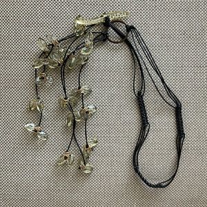 Handmade knotted leather necklace with handmade resin petals. 27 inch length.
